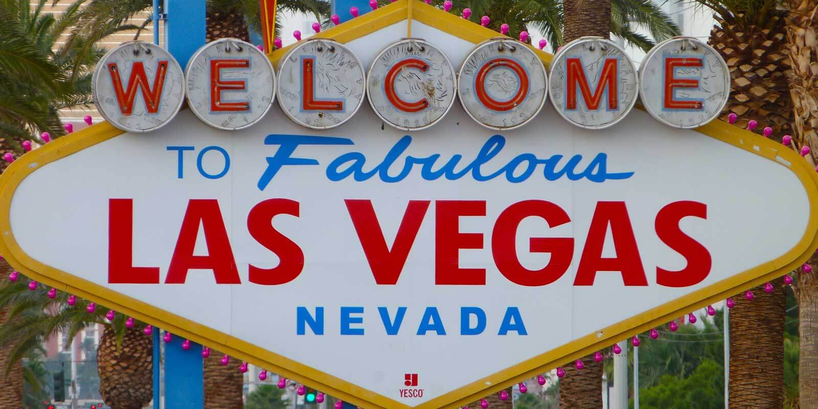 Sign Lights Up At Night With Palm Trees And A Sign To Las Vegas Background,  Picture Las Vegas Sign Background Image And Wallpaper for Free Download